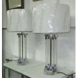 TABLE LAMP, column type in lucite, with brass effect mounts, with shades, 68cm H.