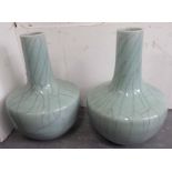 CHINESE STYLE BOTTLE VASES, a pair, in crackle glaze, 45cm H.