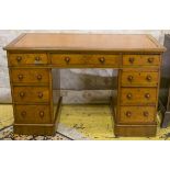 PEDESTAL DESK, Victorian walnut with nine drawers and a tooled leather top,