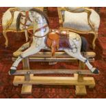 ROCKING HORSE, painted, of small size with red leather saddle, 86cm H x 90cm L x 33cm W.