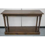 OKA CONSOLE TABLE, rectangular top on turned supports, 85cm H x 140cm x 48cm.