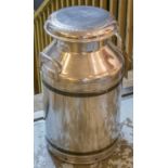 MILK CHURN, patented polish alloy circular with lid stamped, 62cm H x 34cm.