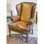 WING ARMCHAIR, William and Mary style oak in close nailed brown leather with cushion seat, 86cm W.
