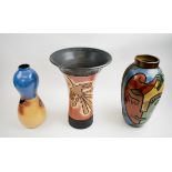 THREE CHULUCANAS PERUVIAN POTTERY VASES, of abstract inspiration, decorated in colours, tallest 34.
