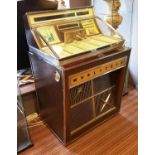 WURLITZER 2900 SERIES JUKEBOX (1962), with records, 132cm L x 84cm H x 68cm W.