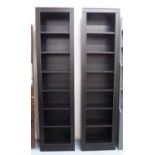 OKA TALL BOOKCASES, a pair, ebonised finish, 220cm H.