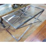 LOW TABLES, the glass top on a polished metal base, 52cm x 113cm x 44cm H.