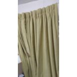 CURTAINS, a pair, woven lime fabric, approx 150cm gathered by 250cm drop.
