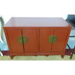 CHINESE LOW CABINET, red lacquer finish, with four doors and internal shelves,