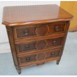 SIDE CHEST, mahogany finish, with three drawers, on turned supports, 58cm W x 39cm D x 64cm H.