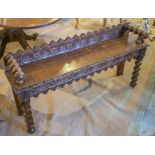HALL BENCH, Victorian gothic, oak with turned bolster handles, carved rosette back, 127cm W.