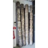 FOUR OCEANIC MANNER TOTEMIC COLUMNS, carved wood, tallest approx 295cm H.