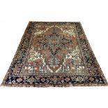 ANTIQUE HERIZ CARPET, 281cm x 211cm, central medallion on a terracotta palmette and vine field,