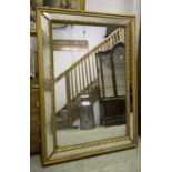 WALL MIRROR, 19th century giltwood with rectangular inner gadroon and leaf cushion frame,