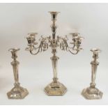 PAIR OF SILVER CANDLESTICKS PLUS A MATCHING CANDELABRUM, with foliate and ribbon-tied decoration,