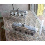 ROLLS ROYCE ENGINE LOW TABLES, a pair, chrome powder coated with rectangular glass tops,