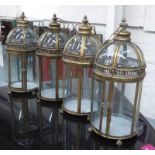 STORM LANTERNS, a set of four, vintage style gilt finish, 55cm H approx.