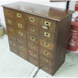 BANK OF DRAWERS, 19th century, walnut, twenty four drawers each with recessed gilt metal handle,