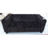SOFA, two seater, in black buttoned fabric on square supports, 183cm L.