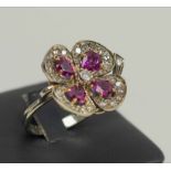 WHITE GOLD 'FOUR LEAF CLOVER' RING, set diamonds and rubies, size N.