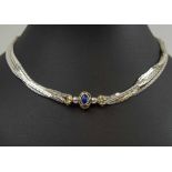 CARTIER FOUR STRAND SILVER NECKLACE, with cabochon lapis setting.