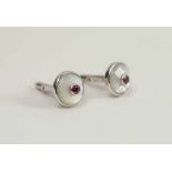 CUFFLINKS, a pair, 18k white gold each set a ruby and mother of pearl.