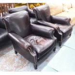ANDREW MARTIN CLUB CHAIRS, a pair, in studded brown leather, on turned castor supports, 83cm W.