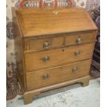 BUREAU, George III mahogany with sloping fall and fitted interior above three drawers on later feet,