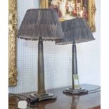 TABLE LAMPS, a pair, Art Deco in the form of military shells with Guniean fowl feathered shades,