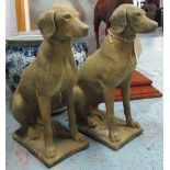 GARDEN DOG STATUES, a pair, 19th century inspired, in a weathered Cotswold style stone,