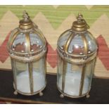 GARDEN LANTERNS, a set of four, each with a handle to the domed top and glazed panels, 51cm H.