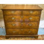 CHEST, early 18th century English Queen Anne figured walnut and two short and three long drawers,