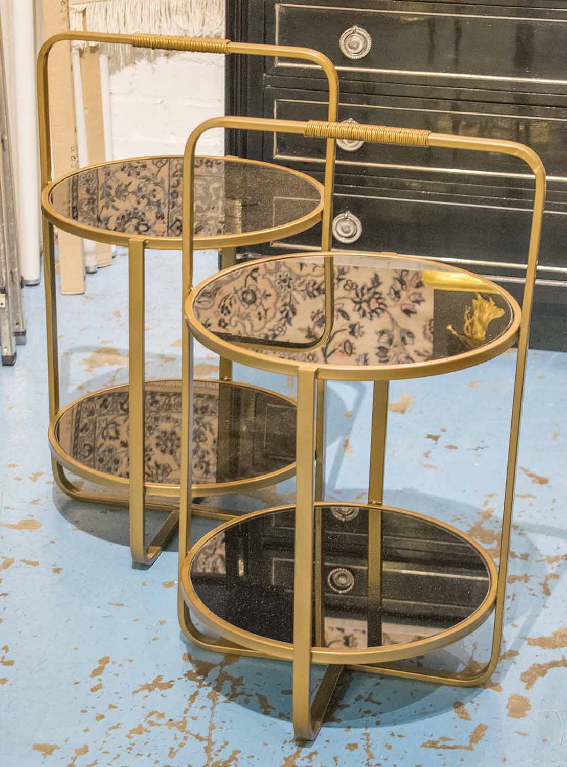 ETAGERES, a pair, gilt metal framed, two tier, each with a circular tempered glass top,