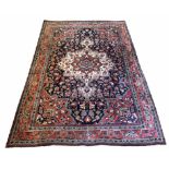 ANTIQUE SAROUK RUG, 200cm x 140cm, pendant ivory medallion on a midnight blue floral field,