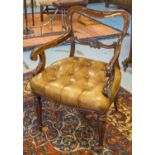 DESK CHAIR, Victorian mahogany with buttoned tan leather seat scroll arms and reeded supports.