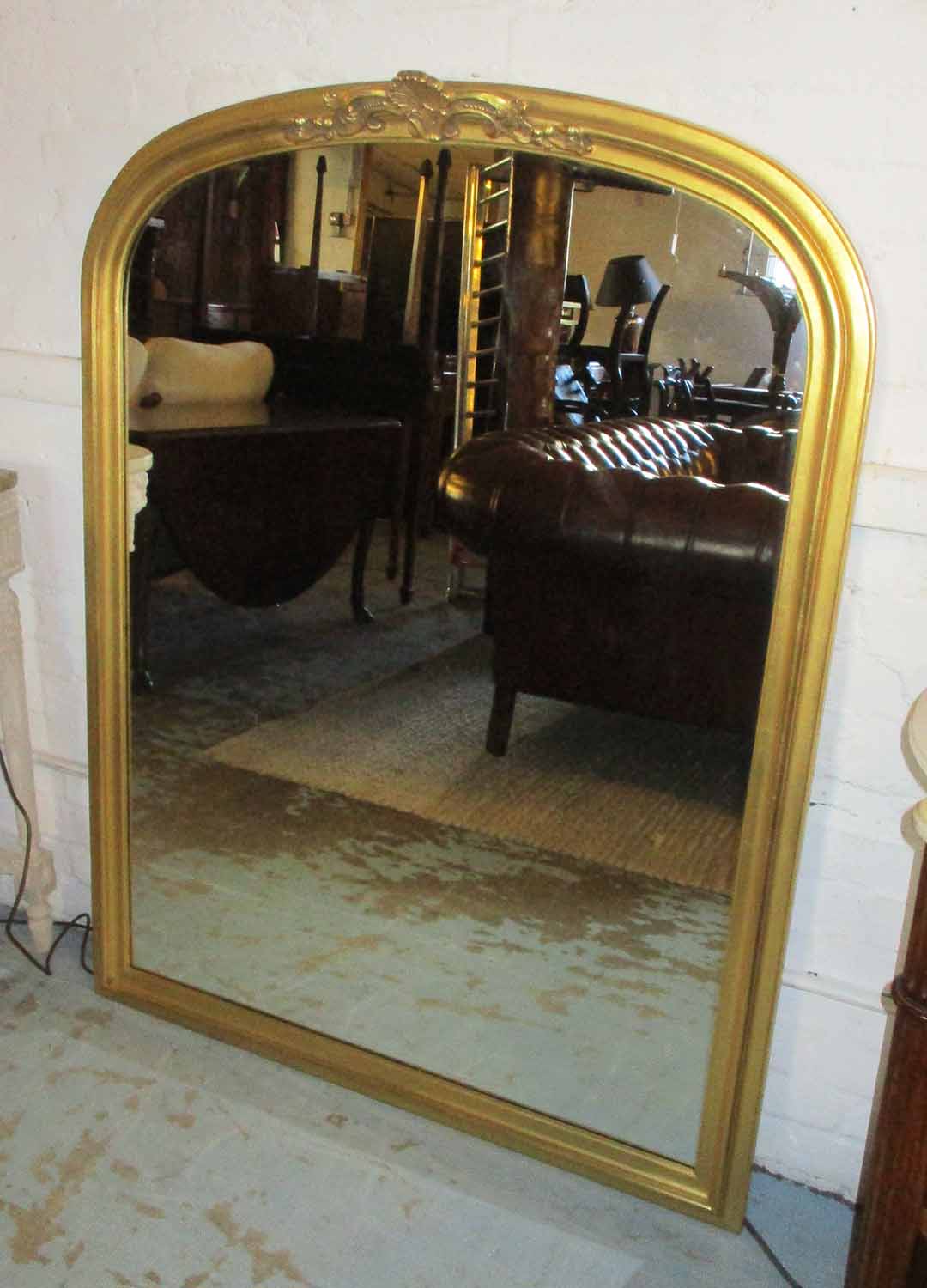 OVERMANTEL, Victorian style, gilt with an arched top, 105cm W x 138cm H.