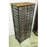 BANK OF DRAWERS, steel with a wooden top enclosing twenty two drawers, 53cm W x 130cm H x 33cm D.