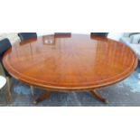 CIRCULAR DINING TABLE, with segmented yew veneer and band inlaid top, pedestal base,