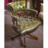 DESK CHAIR, Captains type in buttoned green leather with swivel seat, 61cm W.