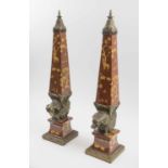 OBELISKS, a pair, ceramic and bronze mounted with elephant supports, 65cm H x 14cm.