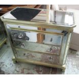 MIRRORED CHEST, of three drawers with canted corners on square supports, 92cm x 51cm x 82cm H.