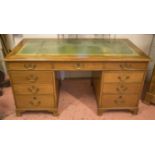 PEDESTAL DESK, early 20th century mahogany with green leather top above nine drawers,