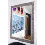 MIRROR, bevelled in a silvered frame, 103cm x 74cm.