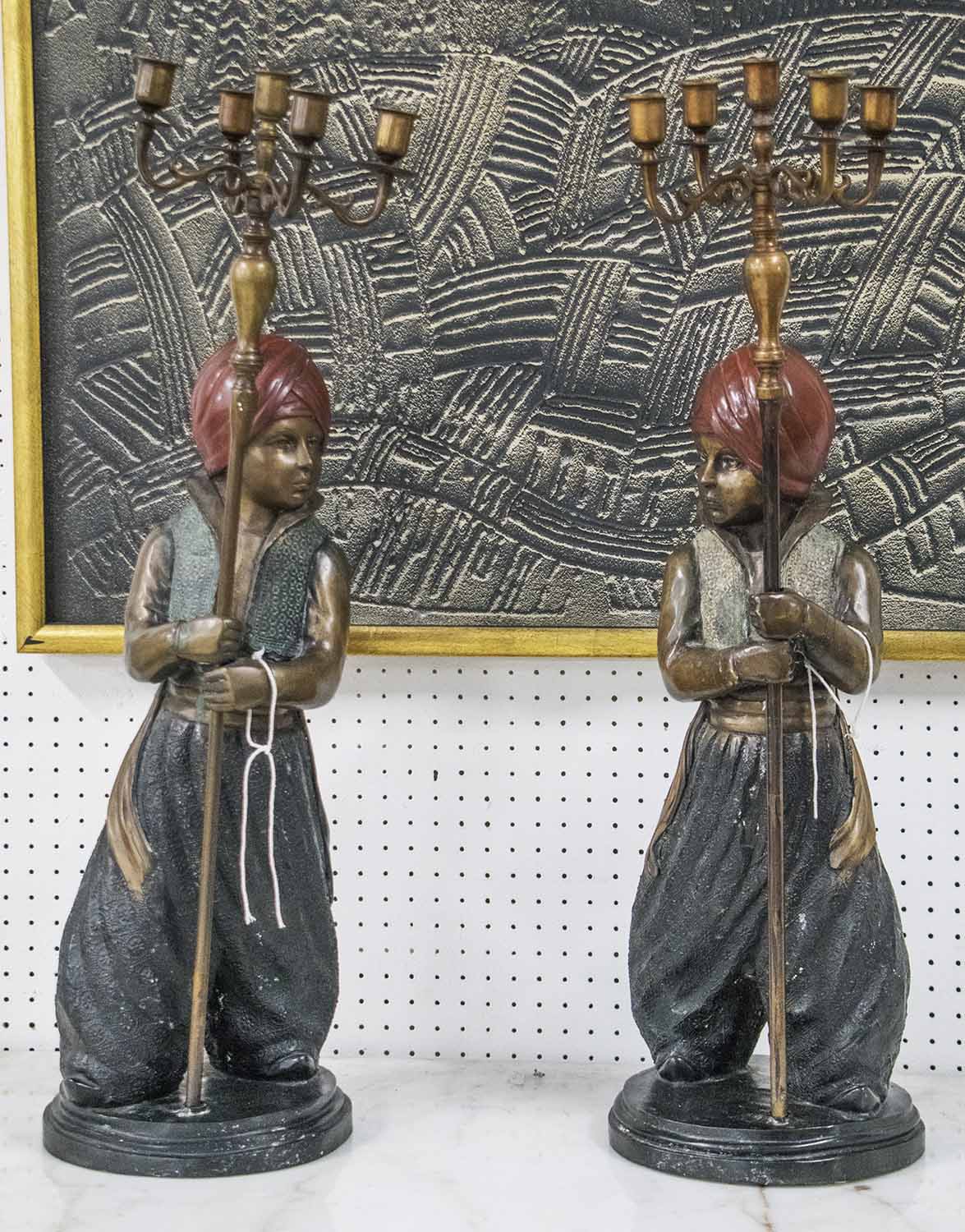 CANDELABRA, a pair, patinated bronze in the form of young blackamoor's holding five sconces, 73cm H.
