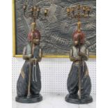 CANDELABRA, a pair, patinated bronze in the form of young blackamoor's holding five sconces, 73cm H.