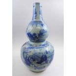 CHINESE BLUE AND WHITE CERAMIC DOUBLE GOURD VASE, decorated figures in a landscape, 65cm H.