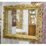 FLORENTINE WALL MIRROR, 19th century carved giltwood rectangular form with foliate frame,