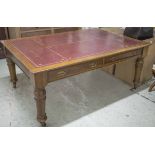 LIBRARY TABLE, Edwardian oak with burgundy leather top above two drawers to each side,