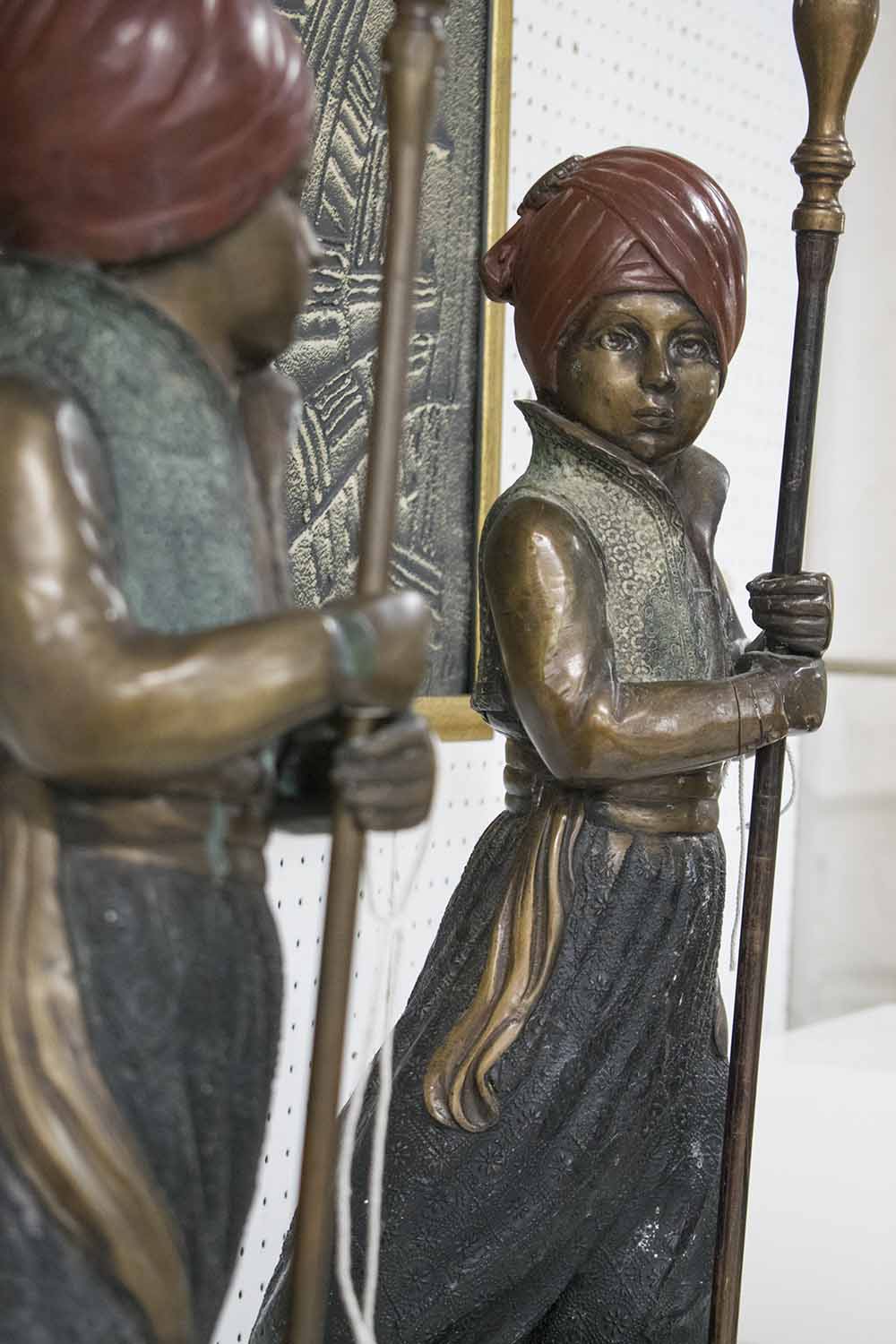 CANDELABRA, a pair, patinated bronze in the form of young blackamoor's holding five sconces, 73cm H. - Image 2 of 2