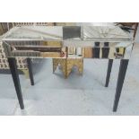 MIRRORED CONSOLE TABLE, having two slanted drawers on ebonised tapering legs,